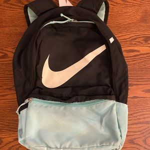 Teal and black nike backpack